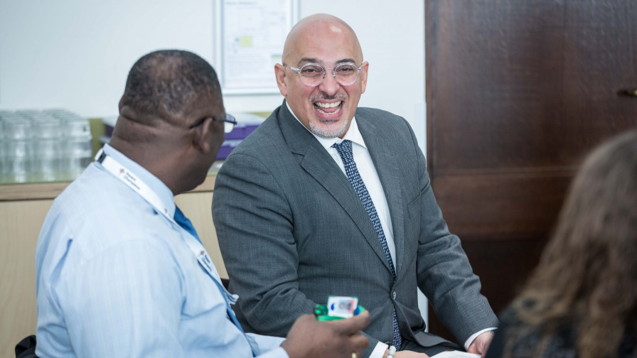 Nadhim Zahawi MP, Parliamentary Under Secretary of State for Children and Families and Michelle Dyson, Director of Early Years and Childcare from the Department for Education, laughing with a Parent Champion