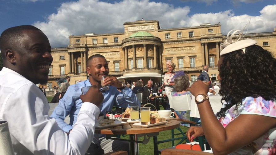 Enjoying tea and the sun at the Queen's garden party