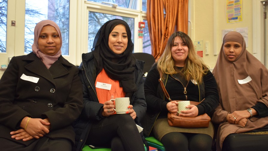 Four Parent Champions pose for a group photo