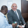 Nadhim Zahawi MP, Parliamentary Under Secretary of State for Children and Families and Michelle Dyson, Director of Early Years and Childcare from the Department for Education, laughing with a Parent Champion