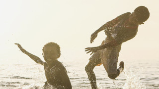 children playing in the sea, sunny day