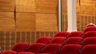 Empty conference hall, red theatre seats