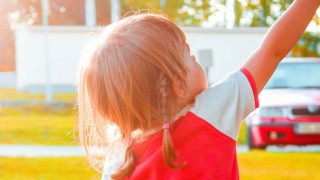 kid playing in lawn