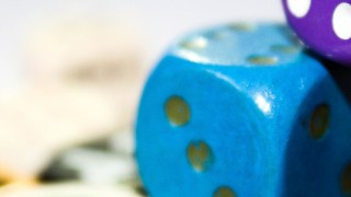 Colourful dice arranged on top of each other