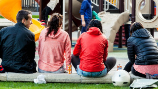 People hang out at child play area