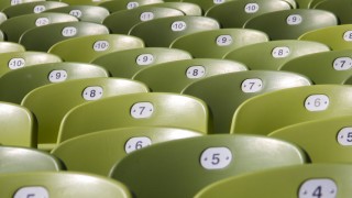 Empty green seats in an auditorium